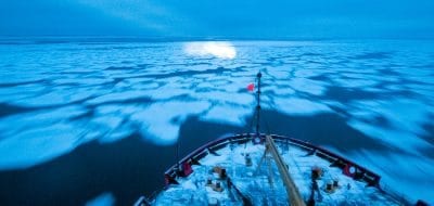 The U.S. Coast Guard icebreaker Healy moves through pancake ice in the Arctic's Chukchi Sea.