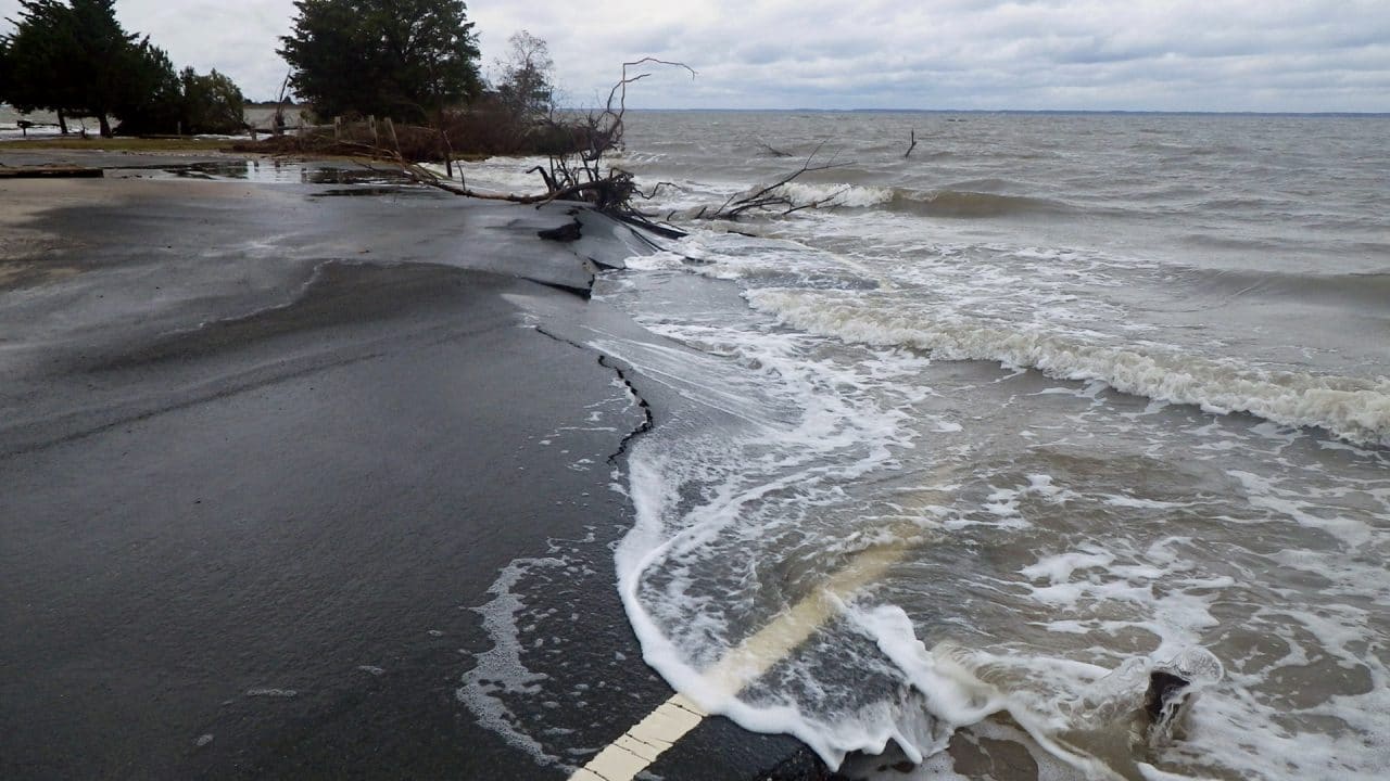 sea washing onto road