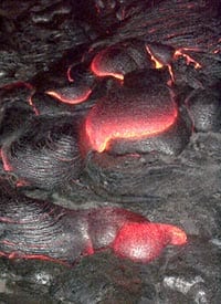 Pahoehoe toes forming in the active part of the Pu’u Oo flow, Kilauea volcano Hawaii in April, 2000. Scale across photo is about 2 meters.