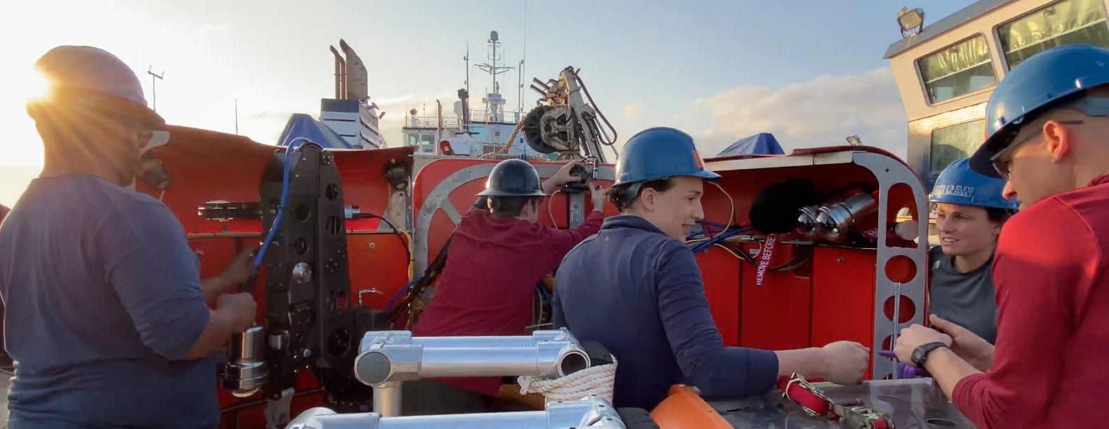 WHOI ROV pilots (left to right) Mario Fernandez, Victor Naklicki, Casey Machado, Molly Curran, and Mike Jacuba work on the Ocean Link's aft deck to get NUI ready to explore the Kolumbo volcano. (Photo courtesy of Mike Toillion, NASA Astrobiology).