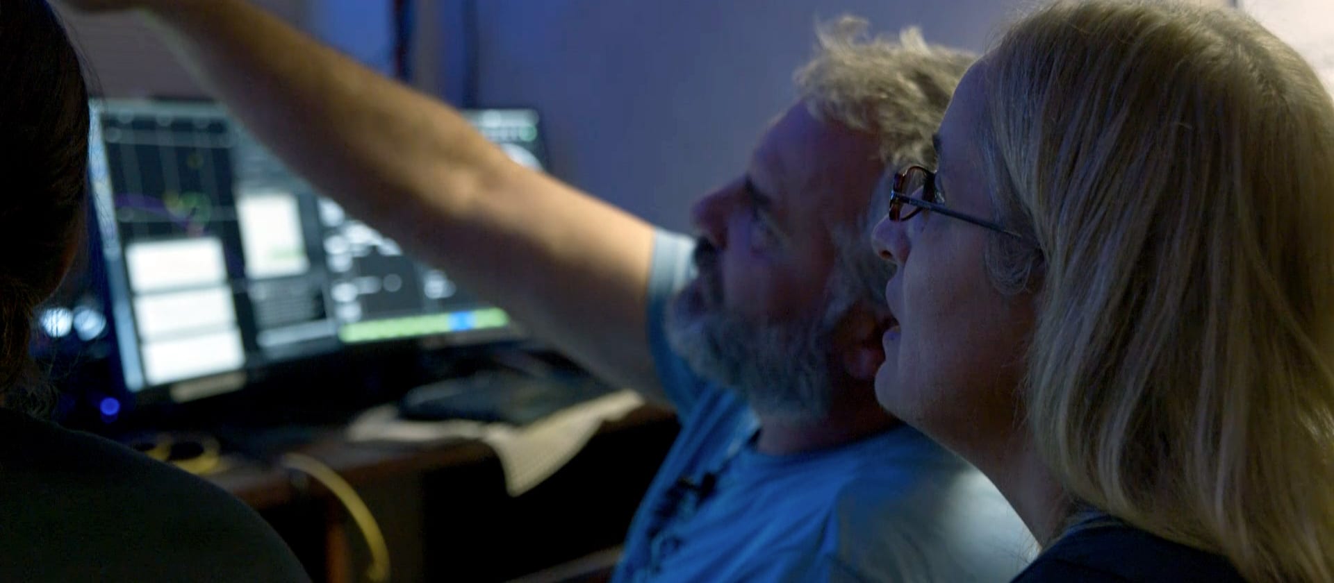 Camilli and Nomikou watch the live video feed from NUI inside the volcano. (Photo courtesy of Stamos Birsim, Olyvon)