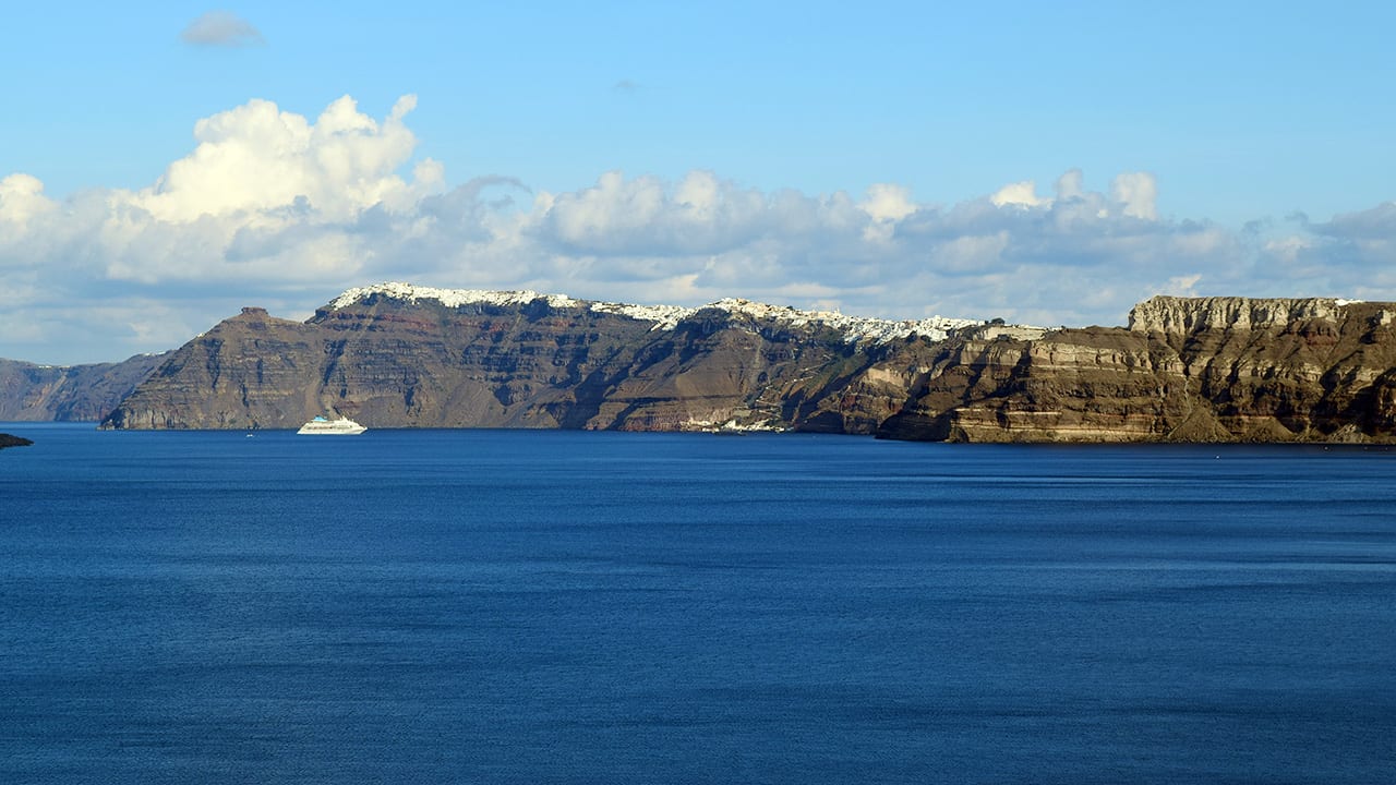 The surface waters of the Aegean Sea off of Santorini Island are calm, but Kolumbo volcano—the region’s most dangerous volcano—is active 500 meters below. (Photo by Evan Lubofsky, © Woods Hole Oceanographic Institution)