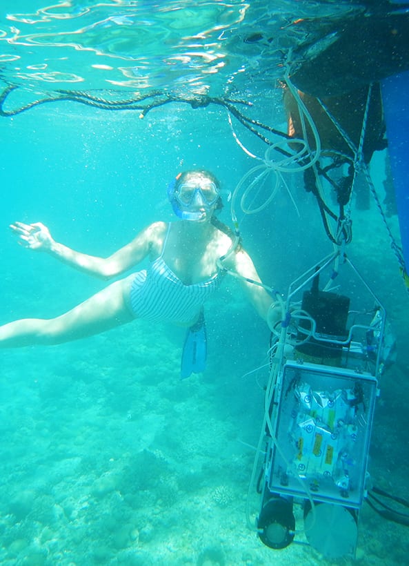 Mallory Ringham hangs on to a suite of sensors, including CHANOS II, in the waters of Eliat, Israel in 2019. (Photo courtesy of collaborator, Boaz Lazar)