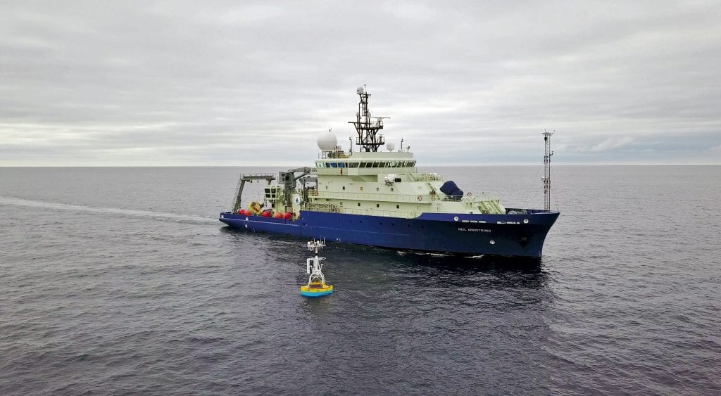 The OOI surface buoy (shown here in 2018 being serviced by the WHOI-operated research vessel Neil Armstrong) will help provide crucial verification of USV and satellite-based models of air-sea interaction in difficult-to-reach high-latitude waters of the North Atlantic and Arctic Oceans. Photo by James Kuo, ©Woods Hole Oceanographic Institution
