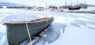 A canoe sits idle in Ulukhaktok, one of several Arctic Inuit communities trying to cope with food insecurity rates that are estimated to be five times the level of food insecurity measured for households in Canada. (Photo by Paul Labn, Oceans North)