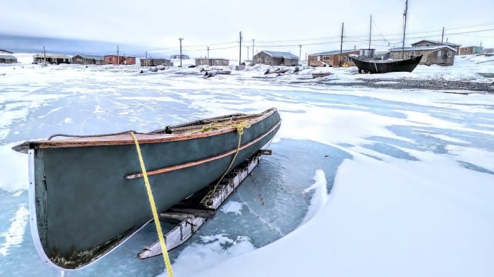 A canoe sits idle in Ulukhaktok, one of several Arctic Inuit communities trying to cope with food insecurity rates that are estimated to be five times the level of food insecurity measured for households in Canada. (Photo by Paul Labn, Oceans North)