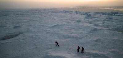 Several intrepid explorers trek out onto the thick Arctic ice sheet to get ice cores that will give them insights into large-scale shifts due to climate change ( Photo by © Luis Lama