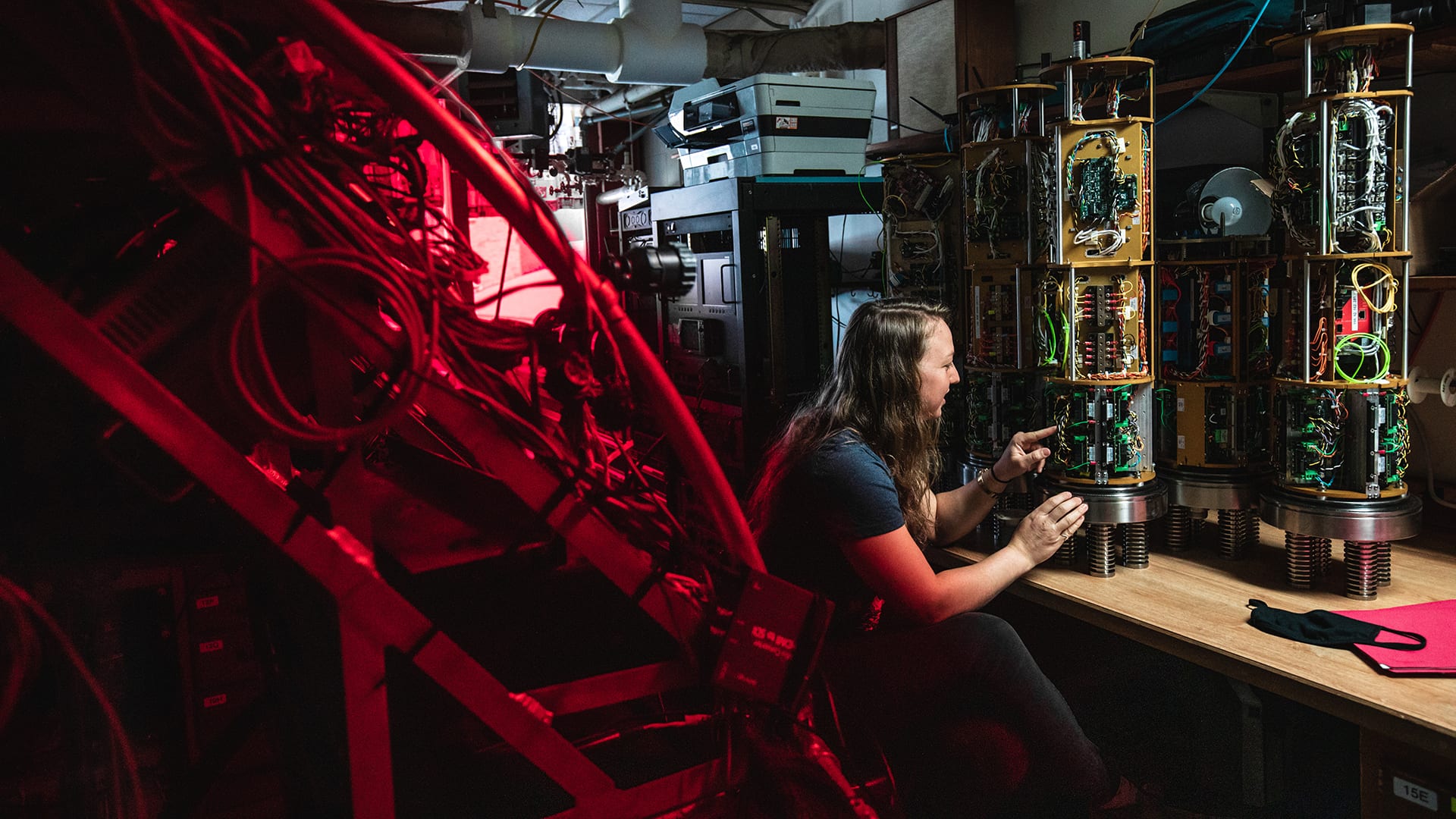 Rose Wall Envi_DH Alvin Group Electrical Engineer Rose Wall working on the power data and imaging chassis that powers and controls the sub's external equipment. (Image Credit: Daniel Hentz © WHOI)