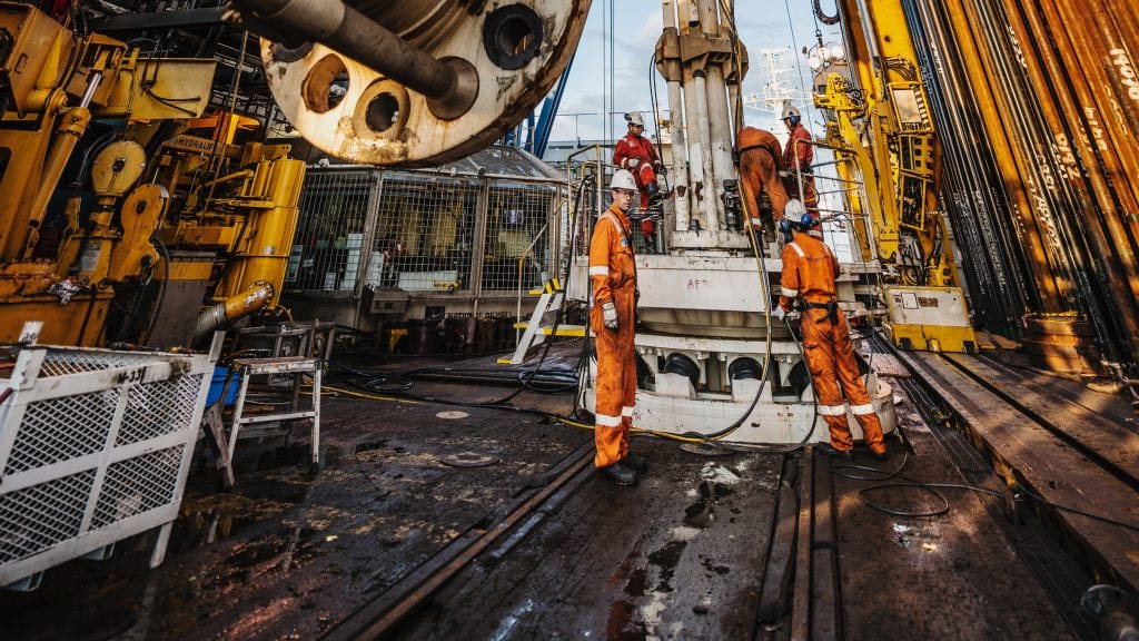 Crew aboard the D/V Chikyu prepare for seafloor drilling