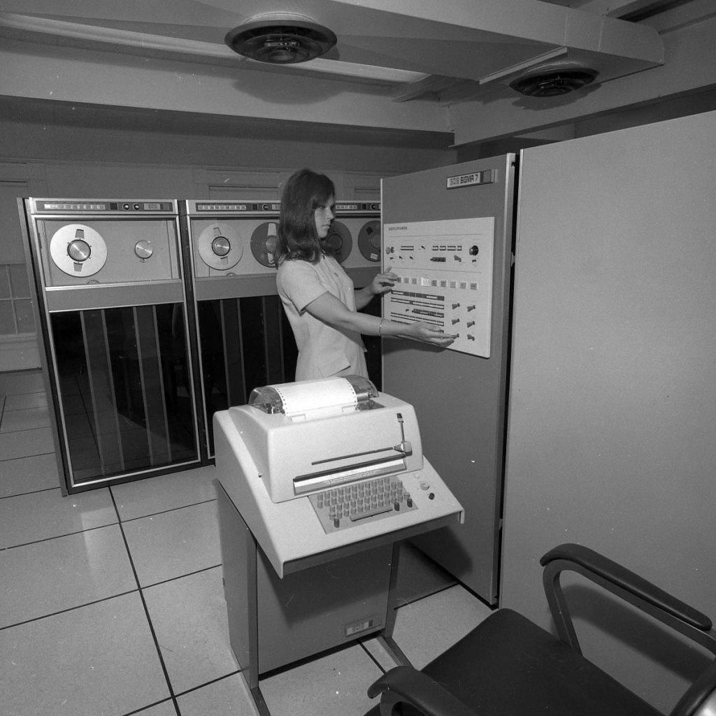 Susan Horton works with a mainframe computer interface in 1965.