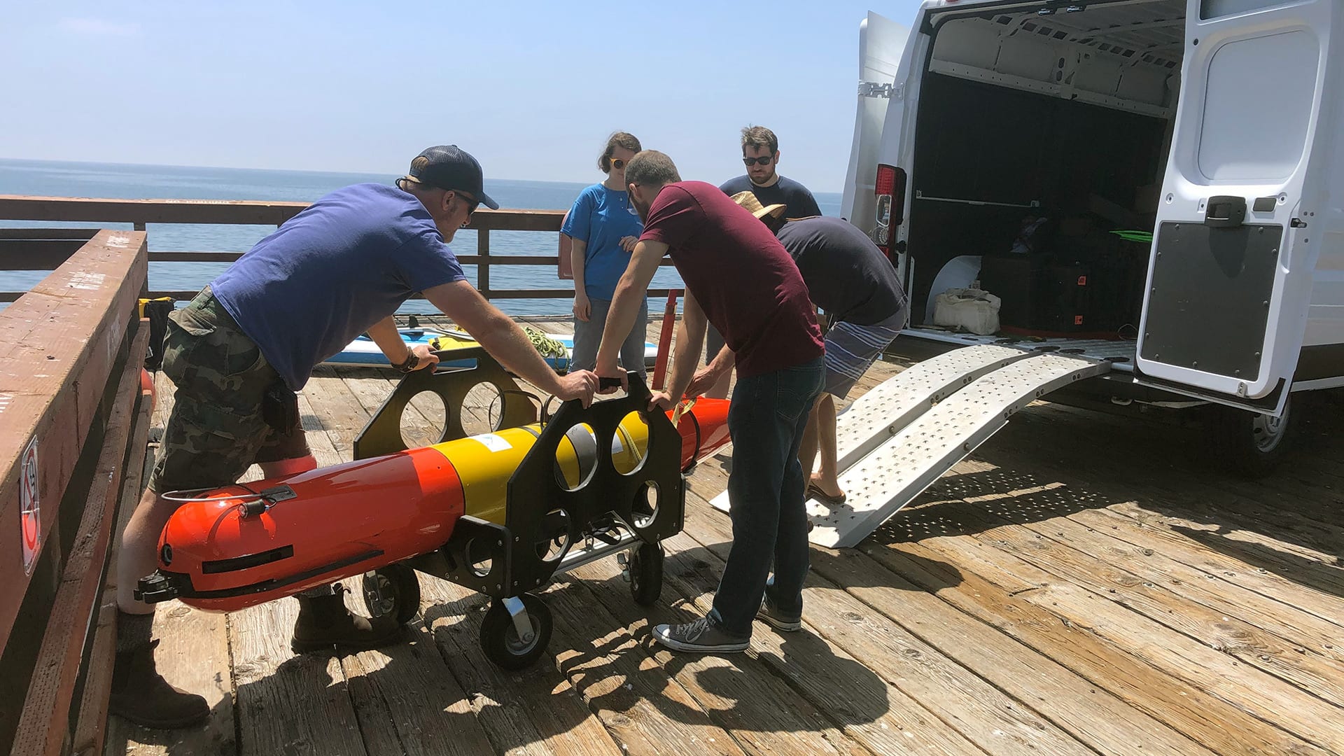 Researchers get the LRAUV ready to deploy for the simulated oil spill response drill. WHOI’s strength in marine operations and logistics, combined with the vehicle’s small form factor and easy-to-handle design, will enable quick mobilization in the event of an oil spill incident. (Photo by Amy Kukulya, Woods Hole Oceanographic Institution)