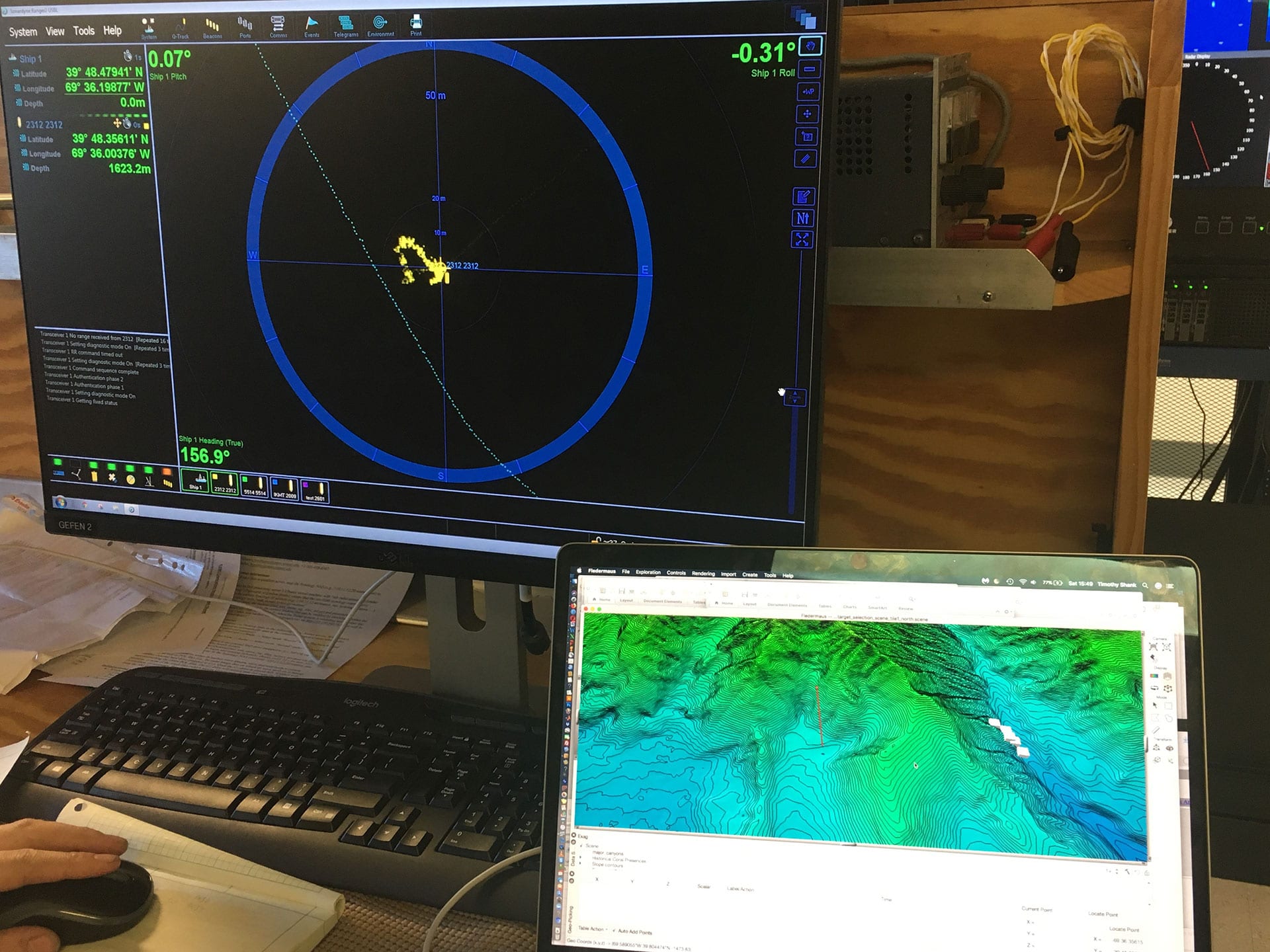 A readout of <em>Orpheus</em>’s location and depth appears on monitors in the <em>Neil Armstrong</em>’s computer lab. (Photo by Tim Shank, Woods Hole Oceanographic Institution) 