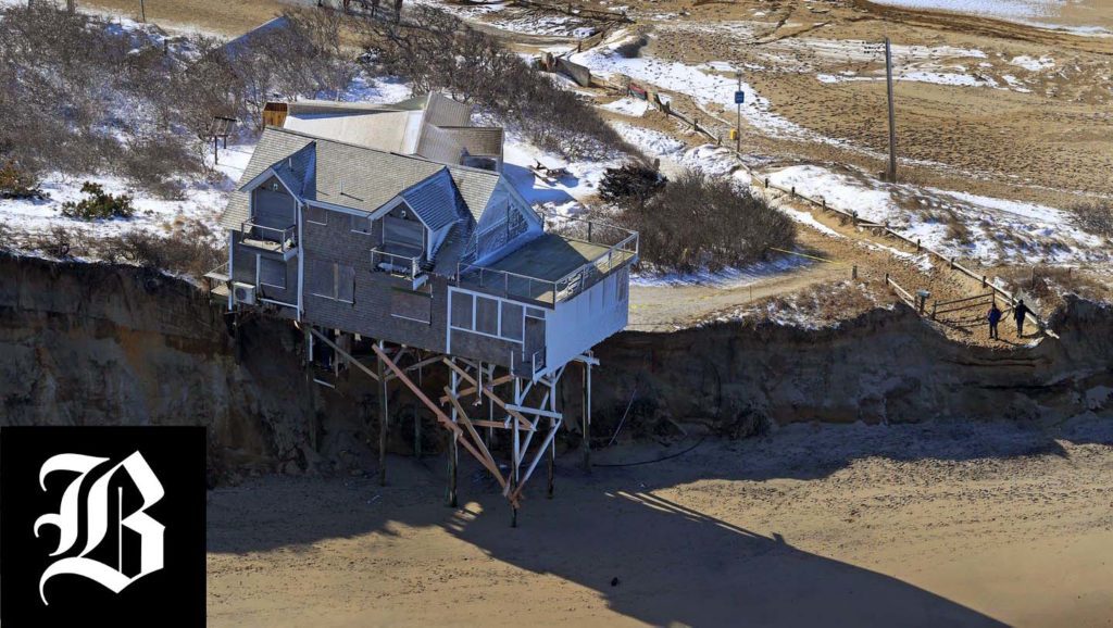 A home in Truro was supported by pilings due to the erosion of the dune it was built on Monday. (DAVID L. RYAN/GLOBE STAFF)