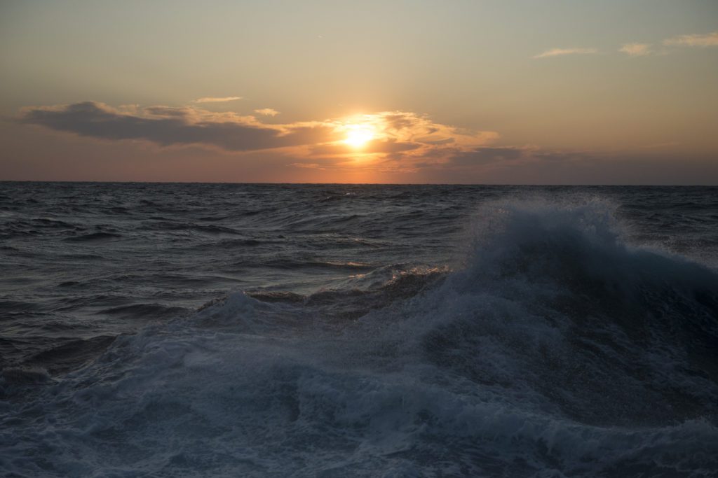 Gulf of Mexico surface waves forming in front of a sunset. Photo by Chris Linder
© Woods Hole Oceanographic Institution