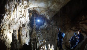 A recent study co-led by WHOI found that the Azores High has expanded
dramatically in the past century, resulting from a warming climate due to a
rise in anthropogenic greenhouse gas concentrations. Researchers associated
with the study collect data inside the Buraca Gloriosa cave in western
Portugal, a site of the stalagmite hydroclimate proxy record. Image credit:
Diana Thatcher/ © Iowa State University