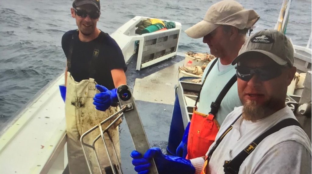 Fishers from the Commercial Fisheries Research Foundation/WHOI Shelf Research Fleet prepare to collect data using an instrument that measures temperature and salinity. This work gives rise to WHOI-led study that shows an increase in warm water intrusions along the Mid-Atlantic Bight. (From L to R: Sean Daly, Victor Garcia, Jay Winchenbach) Image credit: Jim Violet