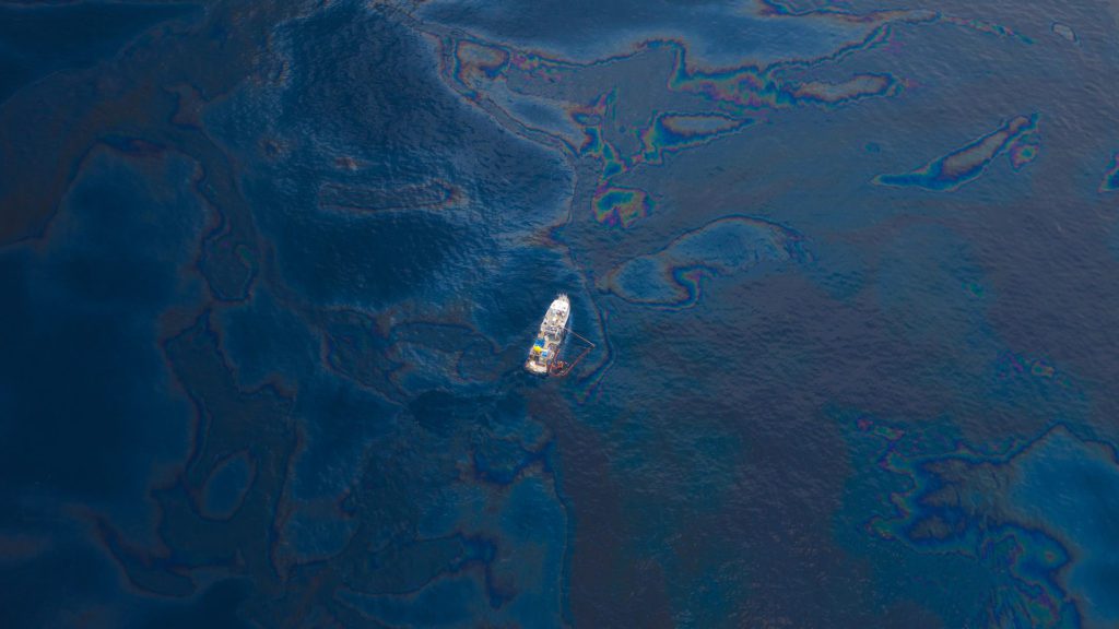 A ship floats in the the Gulf of Mexico after the BP Deepwater Horizon oil spill. (Photo by Kris Krug, Wikimedia Commons)
