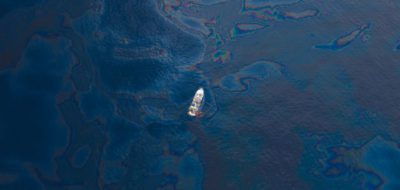 A ship floats in the the Gulf of Mexico after the BP Deepwater Horizon oil spill. (Photo by Kris Krug, Wikimedia Commons)