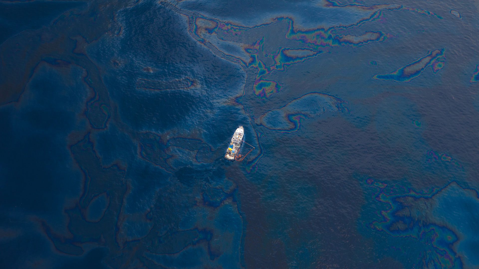 A ship floats in the the Gulf of Mexico after the BP Deepwater Horizon oil spill. (Photo by Kris Krug, Wikimedia Commons)