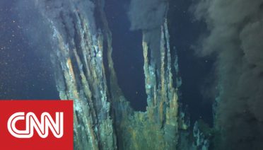 The Beebe Hydrothermal Vent Field, the deepest and hottest known hydrothermal vent in the world, is visible from a dive of the submersible Alvin near the Cayman Islands in the Caribbean. (© Woods Hole Oceanographic Institution)