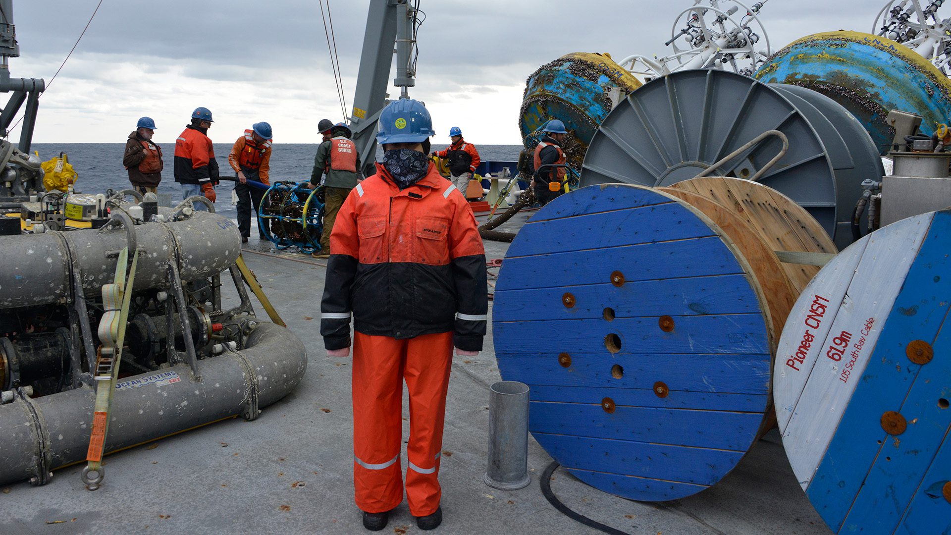 Duran stands on the aft deck of R/V <em>Neil Armstrong</em> in between recovery of observation moorings (Photo by Darlene Trew Crist, © Woods Hole Oceanographic Institution)