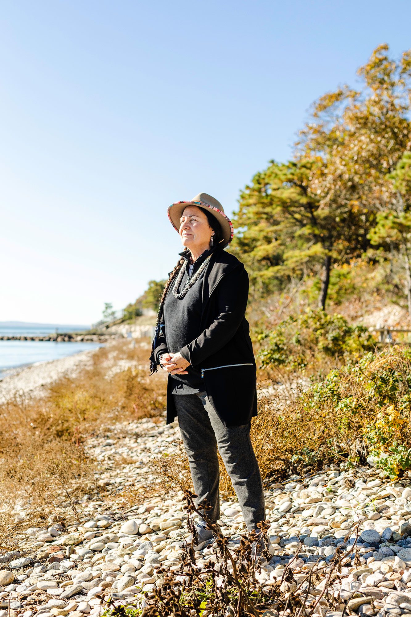 Leslie Jonas takes in the sunlight on Quissett Beach in Woods Hole. (Photo by Daniel Hentz, © Woods Hole Oceanographic Institution)