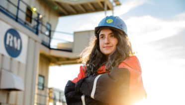 Irene Duran poses on Iselin Dock in Woods Hole. (Photo by Daniel Hentz © Woods Hole Oceanographic Institution).