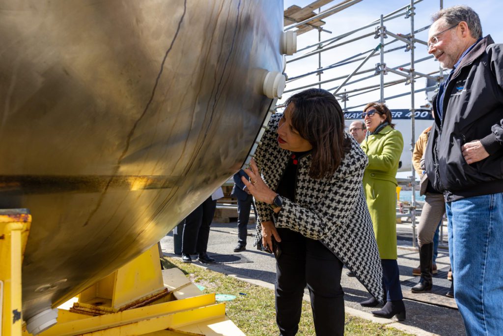 Lt. Governor Kim Driscoll peers inside an Alvin personnel sphere on display at the WHOI dock. (Photo by Joshua Qualls, Governor's Press Office)