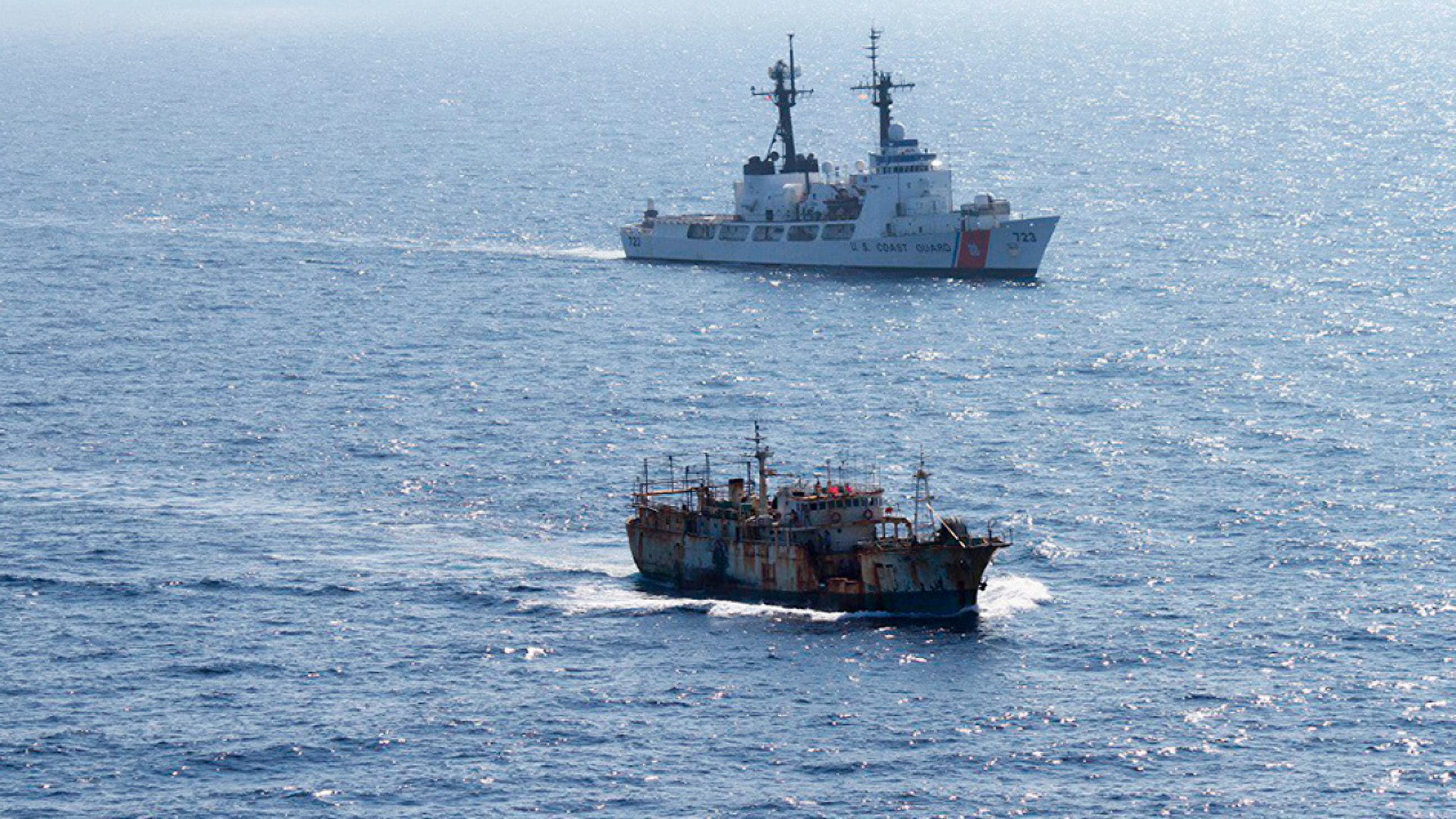 The crew of the Coast Guard Cutter Rush escorts the vessel Da Cheng, suspected of high seas drift net fishing, in the North Pacific Ocean on August 14, 2012. (Image credit: U.S. Coast Guard)
