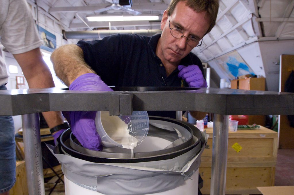 Senior engineering assistant Christopher Griner glues ceramic pressure housings together for former deep-sea hybrid vehicle <em>Nereus</em> 