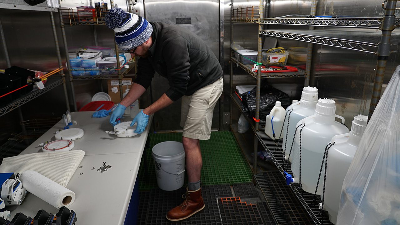 WHOI Research Assistant Fred Marin (Govindarajan laboratory) collects eDNA samples