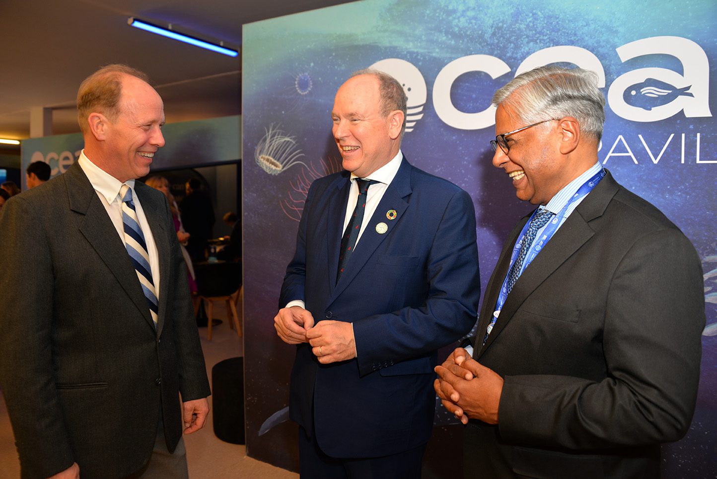 His Serene Highness the Sovereign Prince of Monaco (center) talks with WHOI President Peter de Menocal (left) and Director of the WHOI Marine Policy Center Dr. Kilaparti Ramakrishna (right). (Photo by Elise Hugus, © Woods Hole Oceanographic Institution)