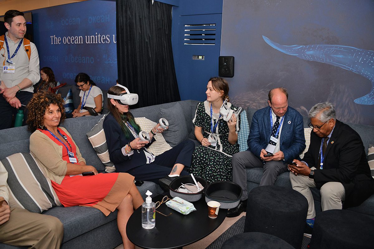 WHOI staff and others enjoy the VR headsets in the Ocean Pavilion's Immersion Lounge. (Photo Elise Hugus, © Woods Hole Oceanographic Institution)