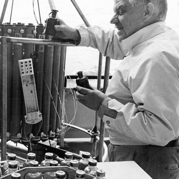 Henry Stommel unloading water samples from a CT rosette (Photo courtesy of WHOI Archives)