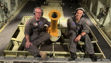 WHOI Physical Oceanographer Steven Jayne and MIT-WHOI Joint Program Student Lawrence Cen take part in a training flight ahead of peak hurricane season. (Photo by Manny Haenggi, Naval Oceanographic Office)