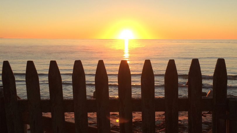 Sunset over Cape Cod Bay (photo by Kara Dodge, © Woods Hole Oceanographic Institution)