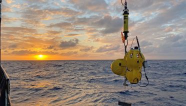 An ocean bottom seismometer being deployed by the Ocean Bottom Scismic Instrument Center during a research expedition to the Gofar transform fault in the Pacific Ocean. (Photo by Hannah Brewer, © Woods Hole Oceanographic Institution)