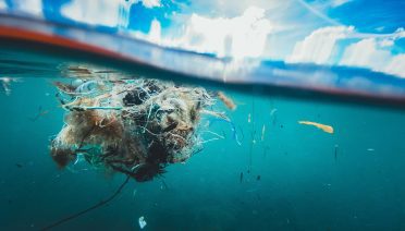A tangled mass of plastic waste drifts beneath the ocean surface in the Mediterranean. (Photo by Naja Bertolt Jensen, Unsplash)