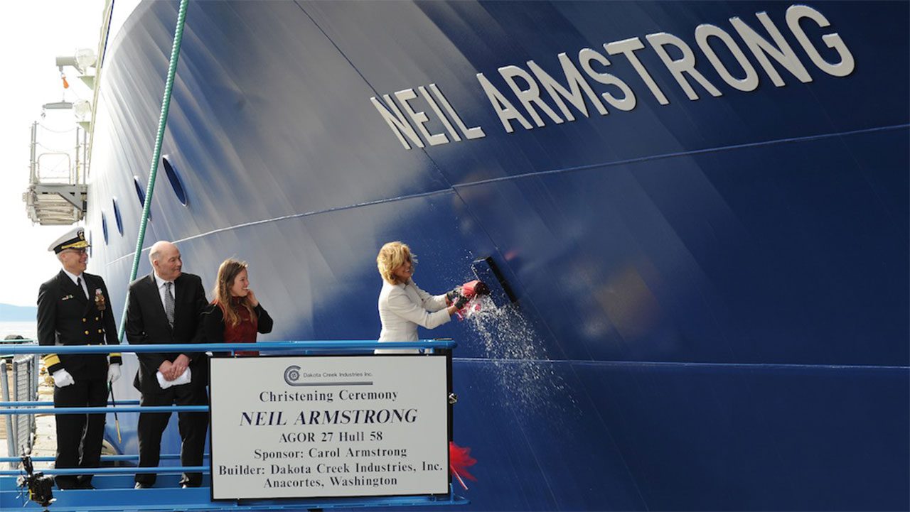 Carol Armstrong christening the ship