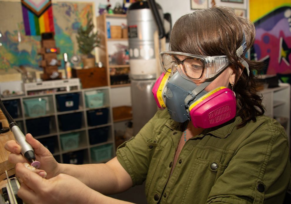 Rogers wears a respirator to protect against silica dust. (Photo by Elise Hugus/WHOI)