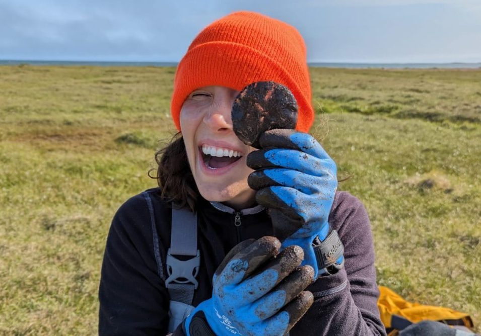 WHOI coastal hydrologist Julia Guimond holds a section of a core of permafrost during a field work along Alaska's North Slope. (Photo courtesy of Julia Guimond, © Woods Hole Oceanographic Institution)
