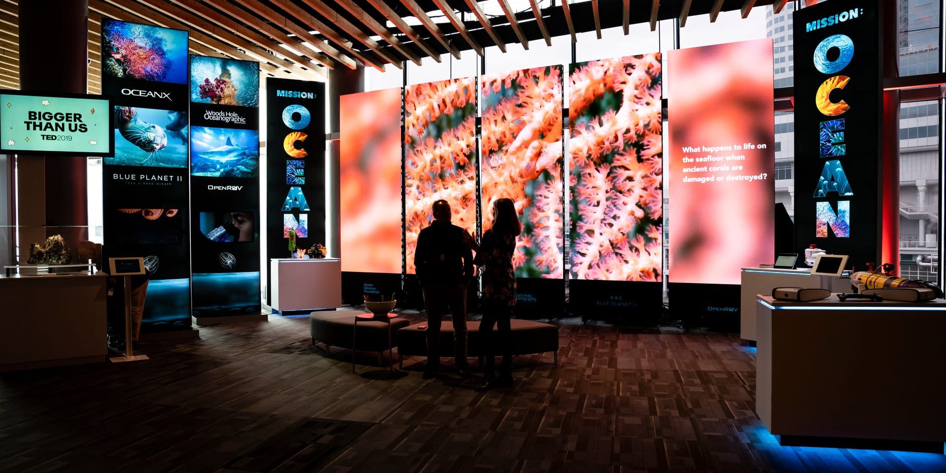 WHOI Deep Submergence Laboratory director Andy Bowen and BBC Blue Planet II producer Orla Doherty talk at the Mission:Ocean exhibit at the TED 2019 annual conference in Vancouver. The immersive installation is a collaboration between WHOI, OceanX, and the BBC, supported and designed by the Avatar Alliance Foundation. (Photo by Marla Aufmuth © TED)
