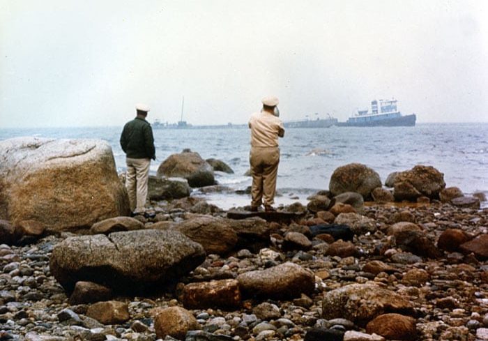 United States Coast Guard officers talking with barge Florida. (Photo courtesy WHOI Archives)